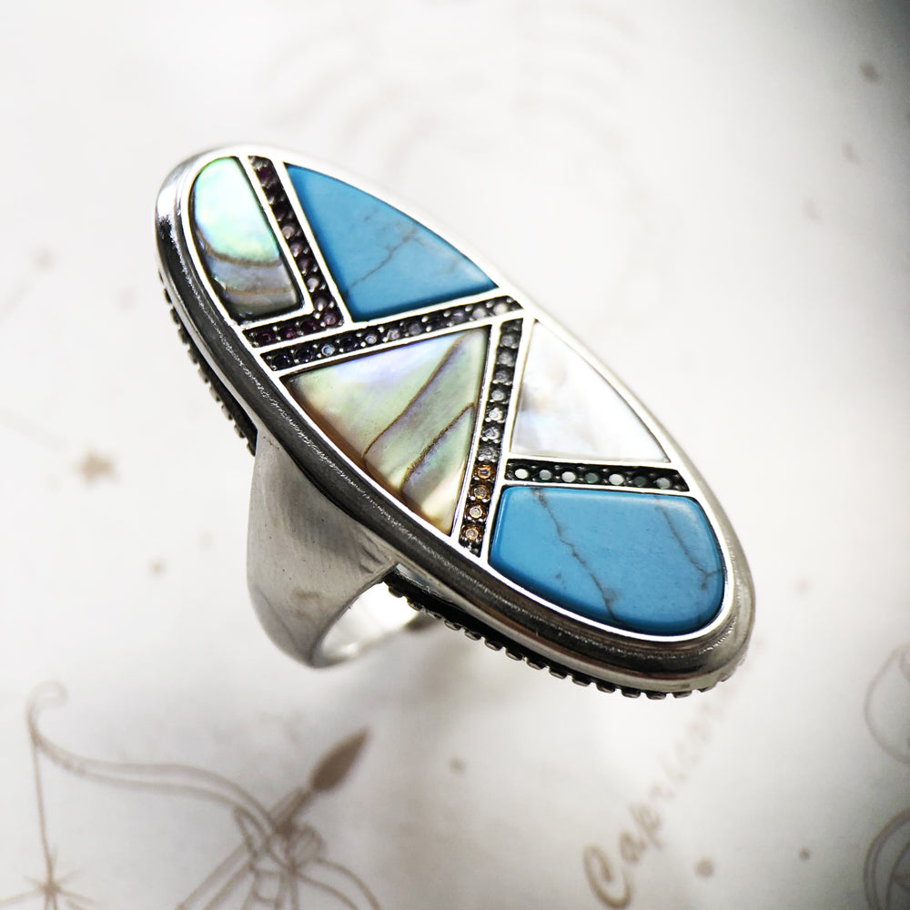 Anel Turquesa Future geométrico em Prata 925 é única e elegante para complementar qualquer look. Anel Feminino Future é uma joia moderna, requintada cravejada em pedras naturais em formatos geométricos!